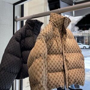 Balenciaga Beige and Black Logo Puffer Jackets sold separately